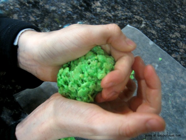 have your child rool the cooled rice krispy treats in to bite sized balls and set on wax paper - celebrate something on a stick day with kids @dapperhouse