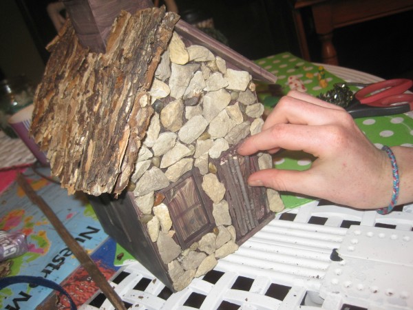 A wooden craft store bird house can become a fairy home with  a  glue gun, stones and sticks DIY @dapperhouse